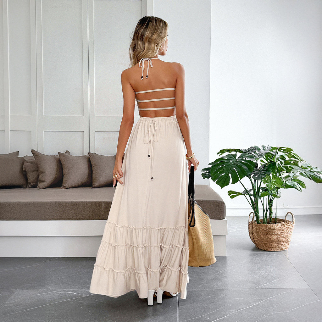Abito donna con collo halter e gonna fluida a balze