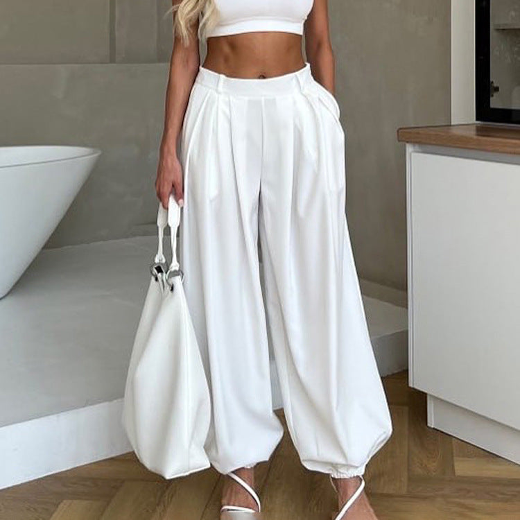 Pantaloni donna bianchi a vita alta dal taglio ampio