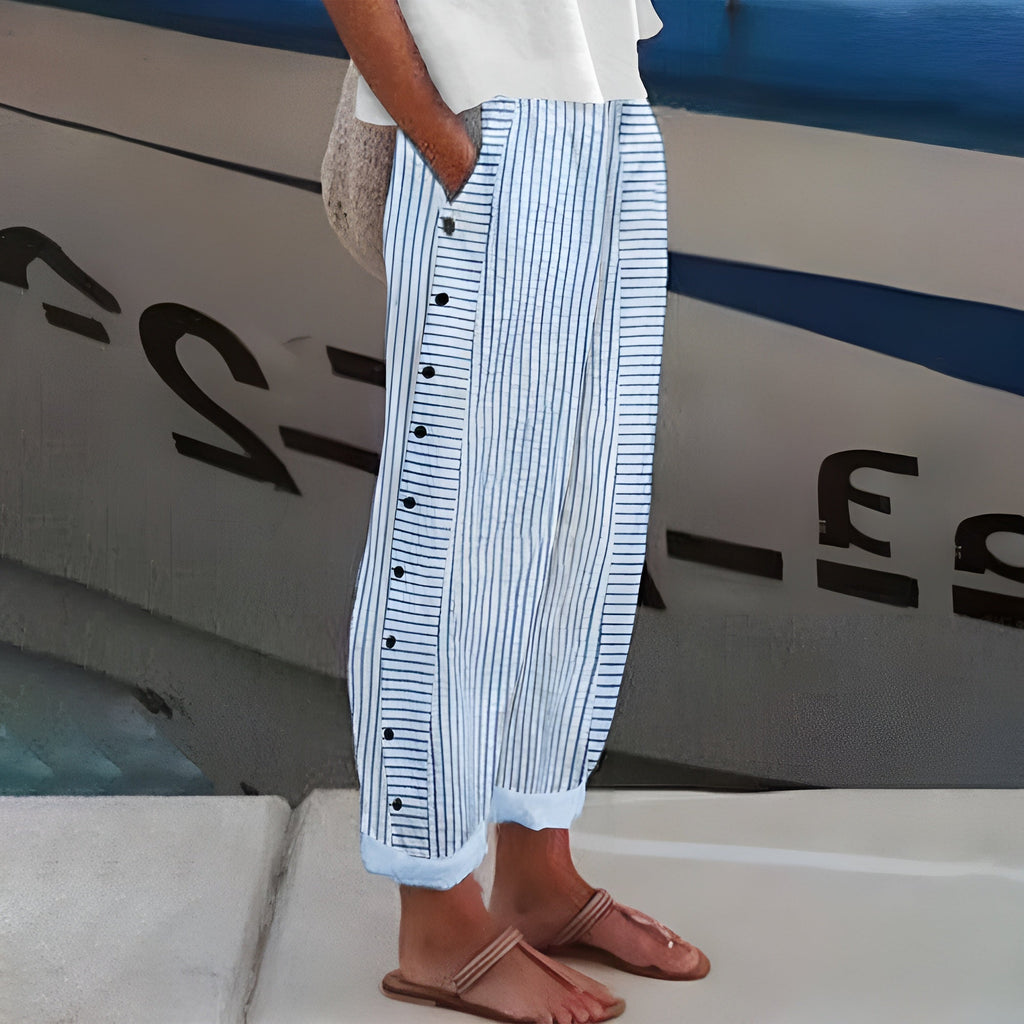 Pantaloni donna a righe con bottoni a contrasto - Chic e fluidi