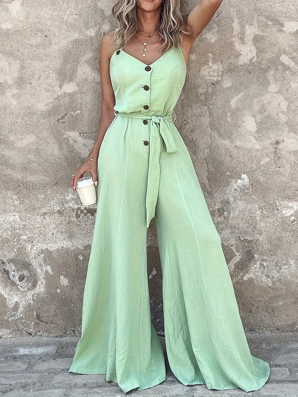 Tuta donna verde menta con lacci e taglio elegante