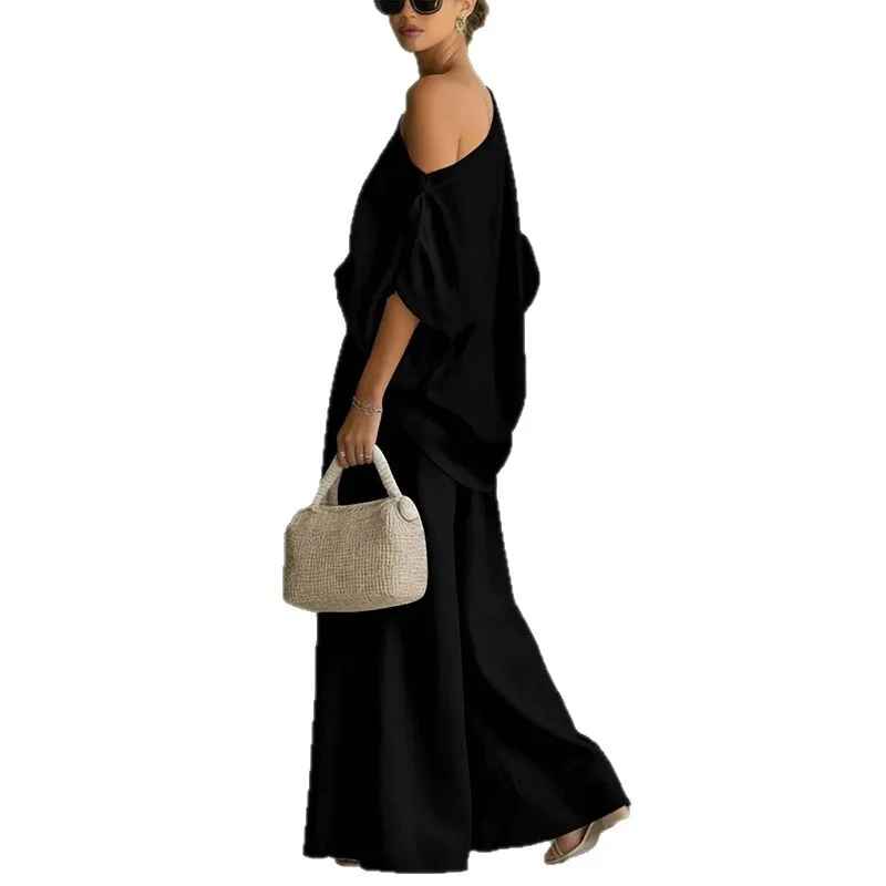 Completo donna con top spalle scoperte e pantaloni affusolati – Leggero e chic
