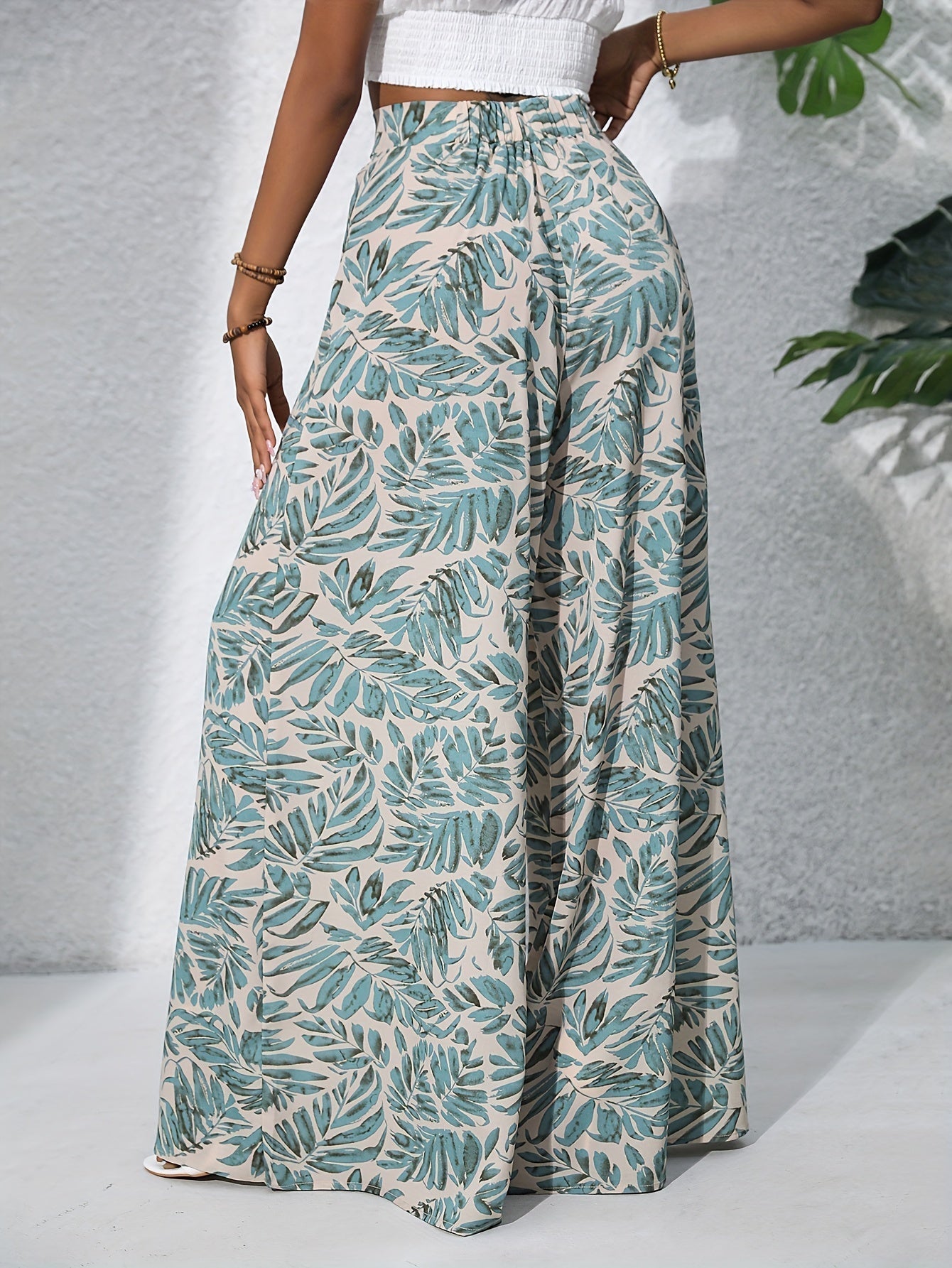 Pantaloni palazzo da donna a vita alta con stampa floreale - Fluidi ed eleganti