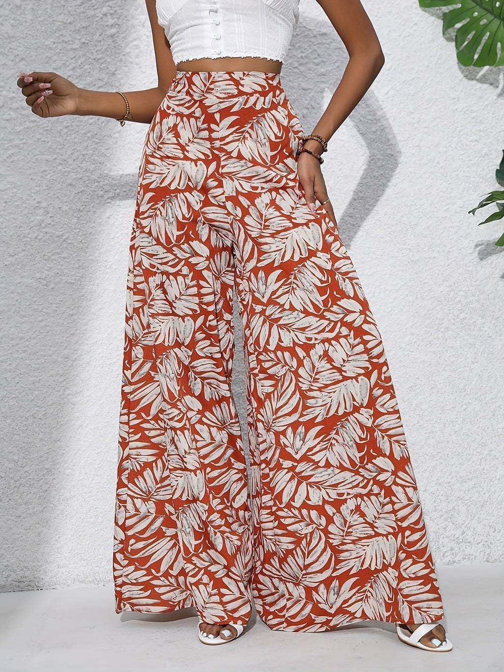 Pantaloni palazzo da donna a vita alta con stampa floreale - Fluidi ed eleganti