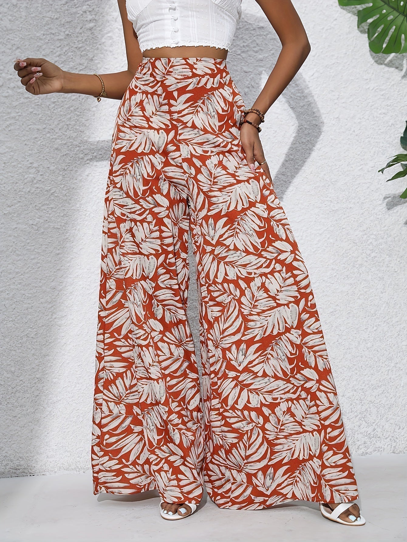 Pantaloni palazzo da donna a vita alta con stampa floreale - Fluidi ed eleganti