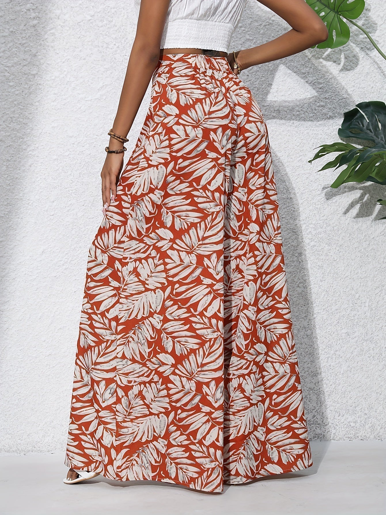 Pantaloni palazzo da donna a vita alta con stampa floreale - Fluidi ed eleganti