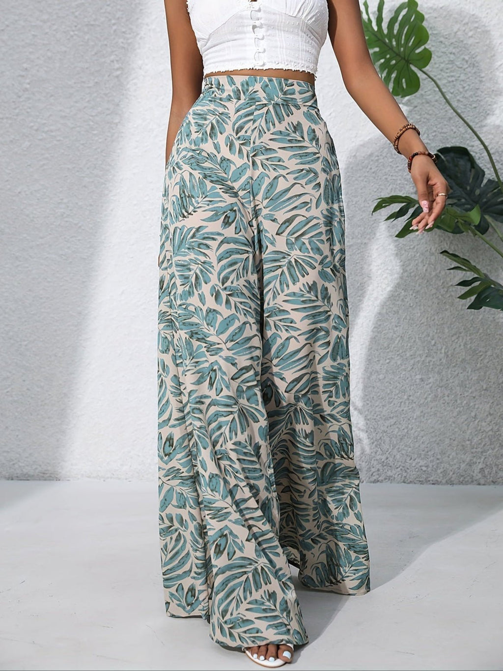Pantaloni palazzo da donna a vita alta con stampa floreale - Fluidi ed eleganti