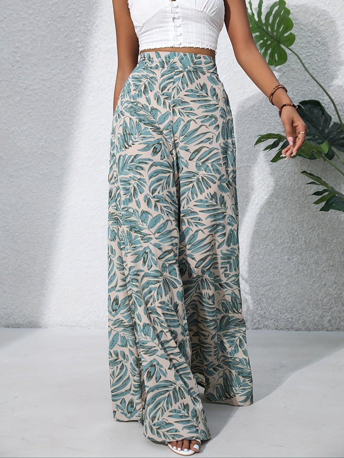 Pantaloni palazzo da donna a vita alta con stampa floreale - Fluidi ed eleganti