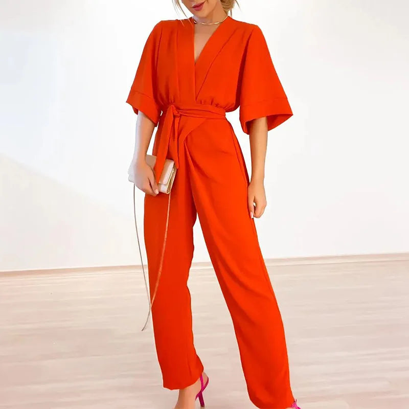Tuta sartoriale sottile e sofisticata da donna con scollo a V