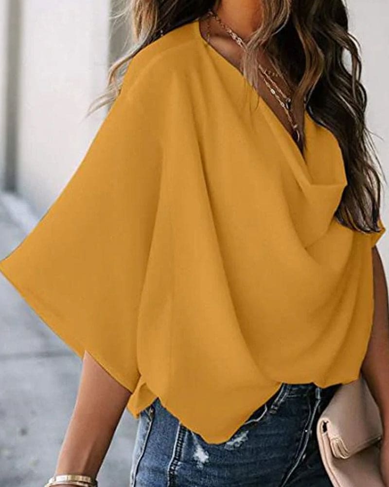 Camicetta da donna con maniche a pipistrello – Elegante, fluida e casual, perfetta per il lavoro.