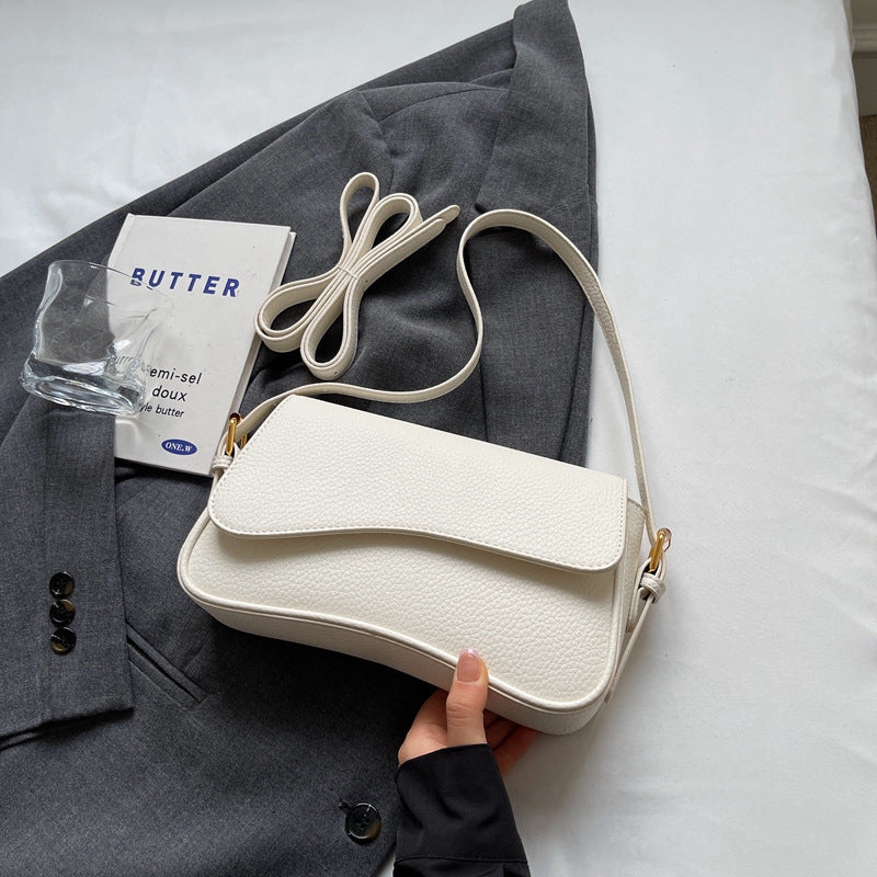 Elegante borsa a mano ondulata in pregiata pelle vegana