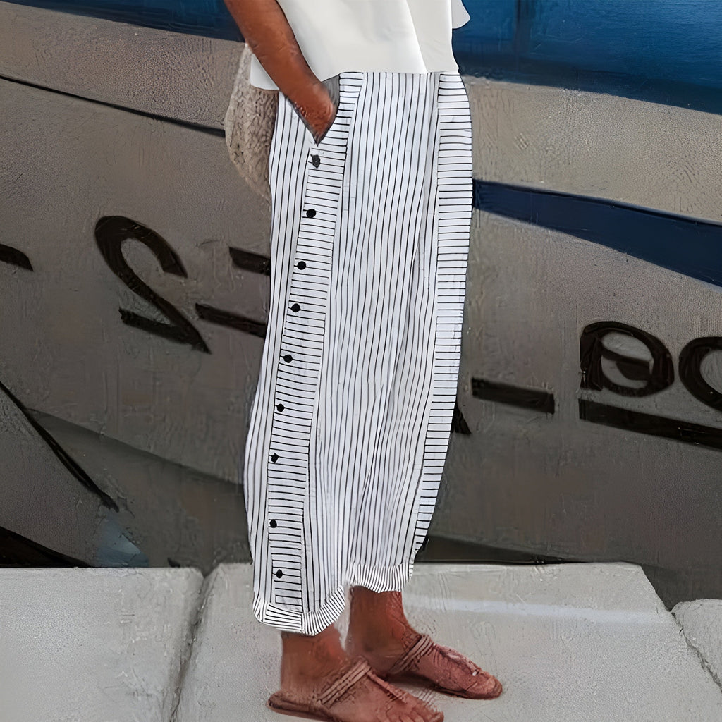 Pantaloni donna a righe con bottoni a contrasto - Chic e fluidi